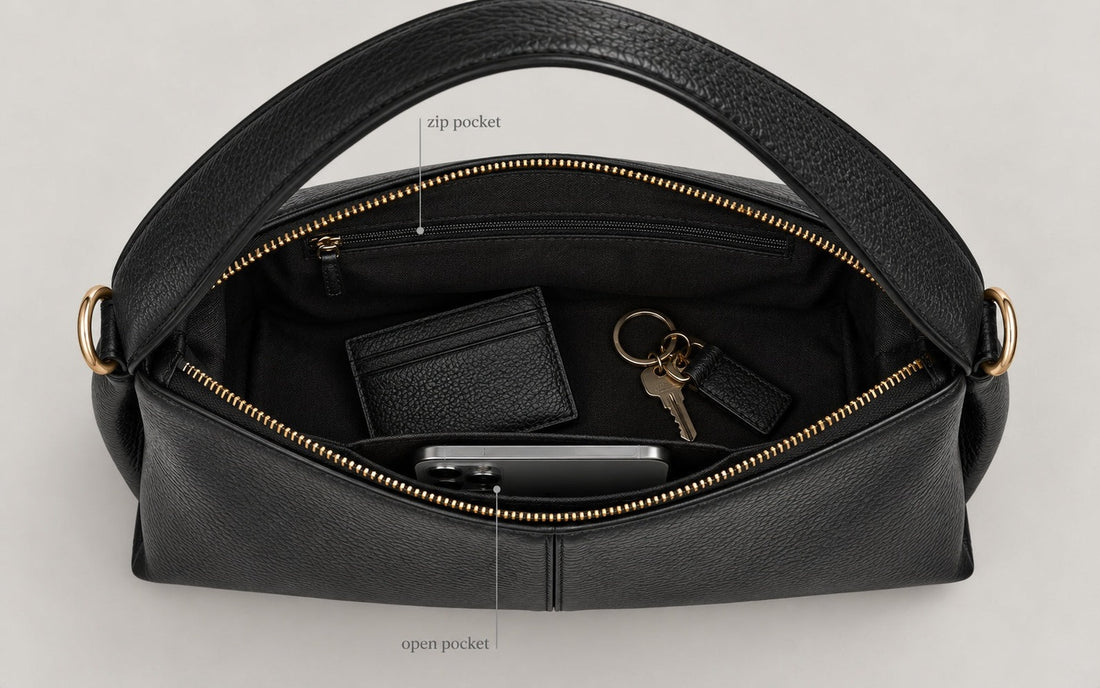 The interior of the Misariva Verona bag seen from above, with phone, wallet and keys