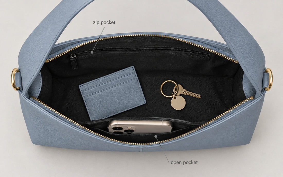 The interior of the Misariva Verona bag seen from above, with phone, wallet and keys