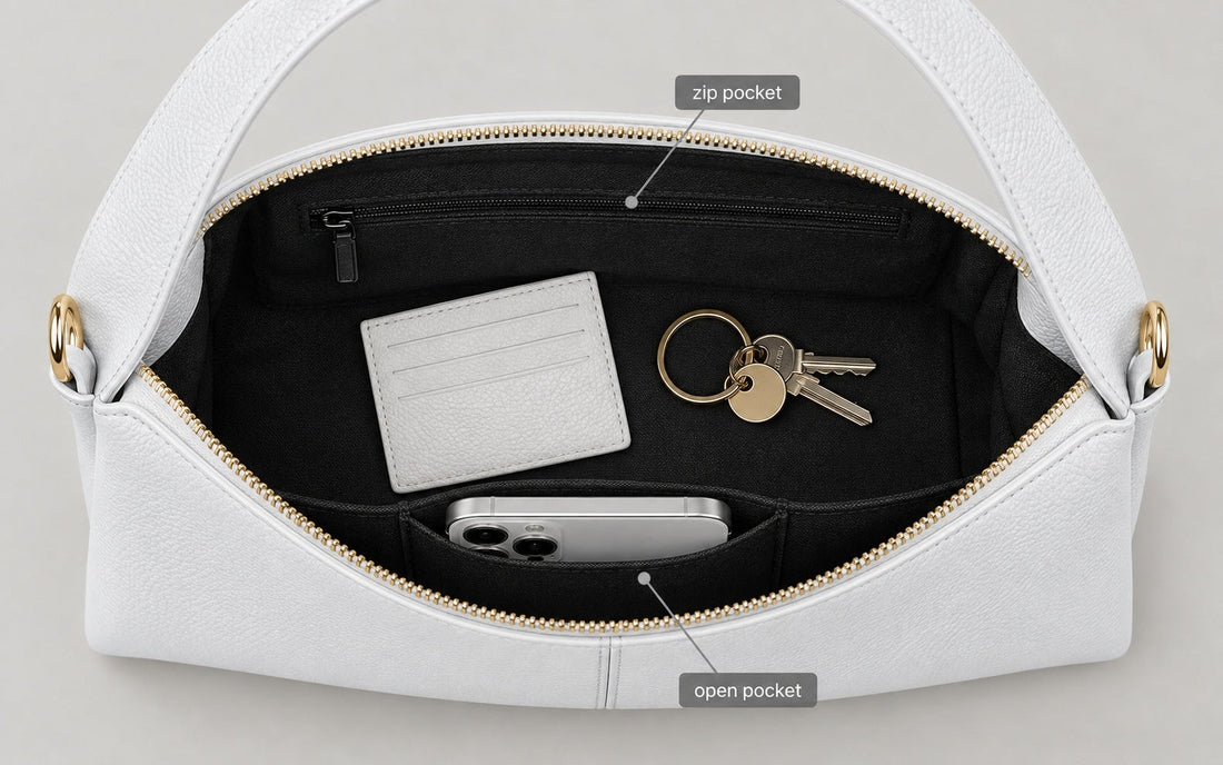 The interior of the Misariva Verona bag seen from above, with phone, wallet and keys