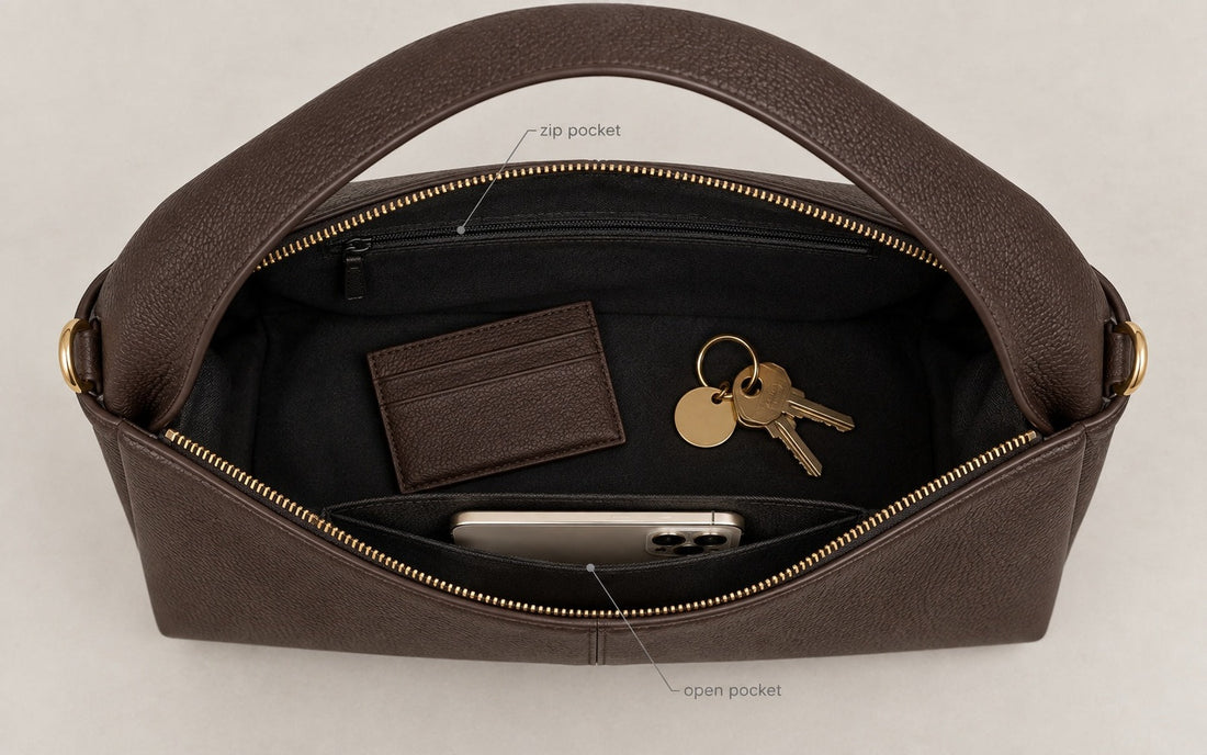 The interior of the Misariva Verona bag seen from above, with phone, wallet and keys