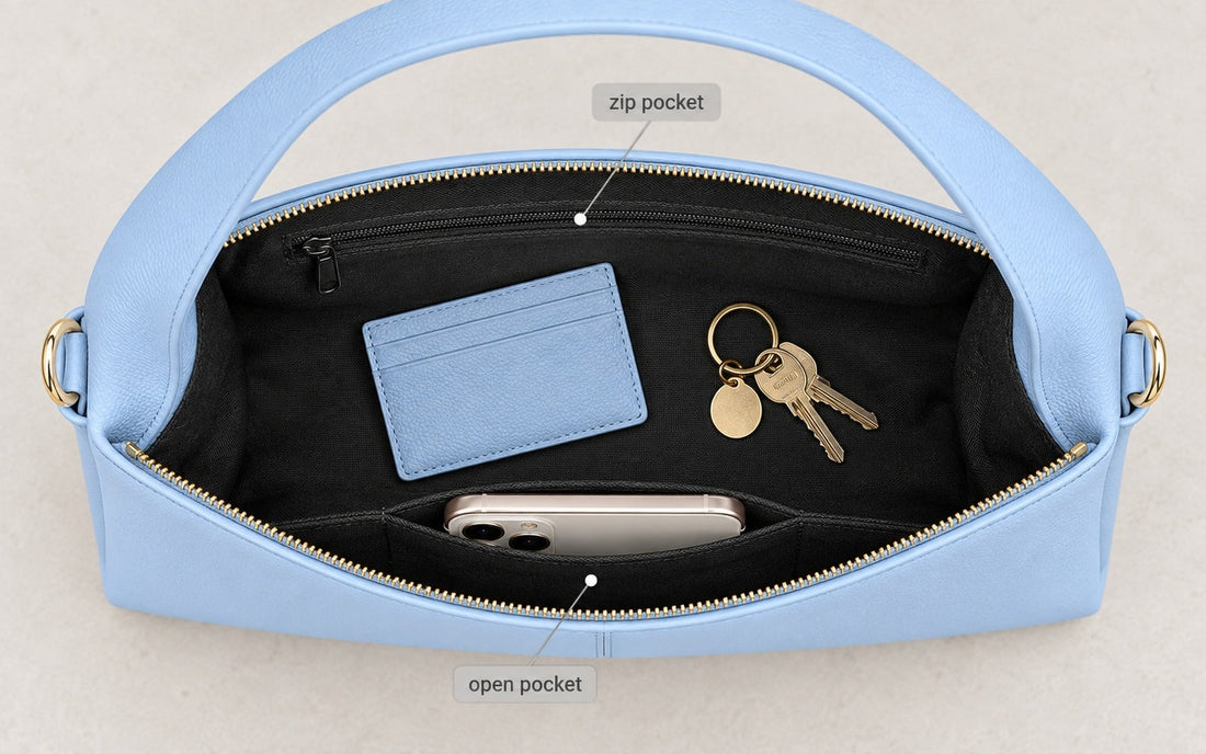 The interior of the Misariva Verona bag seen from above, with phone, wallet and keys