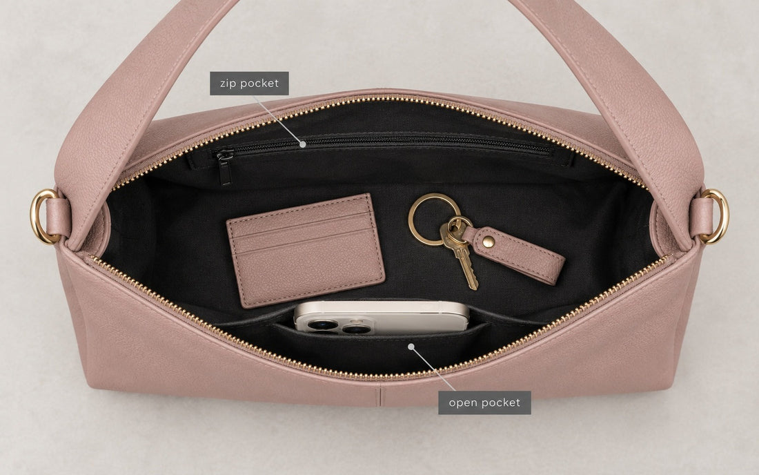 The interior of the Misariva Verona bag seen from above, with phone, wallet and keys
